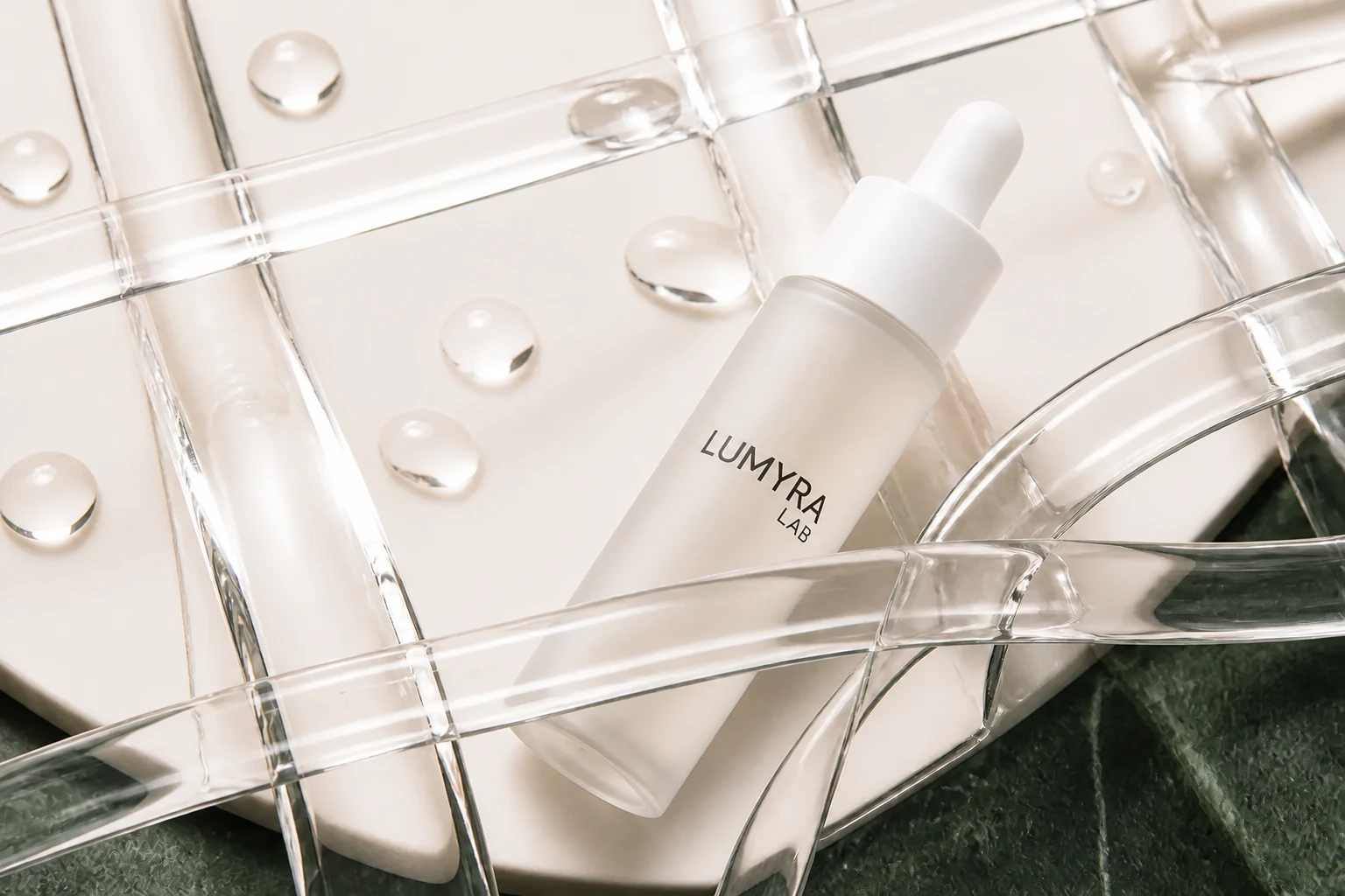 03 Glow Serum among interlocking glass ribbons